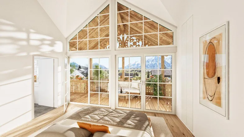 Helles Schlafzimmer mit großen Fenstern, Bergblick und Zugang zu einem sonnigen Balkon.