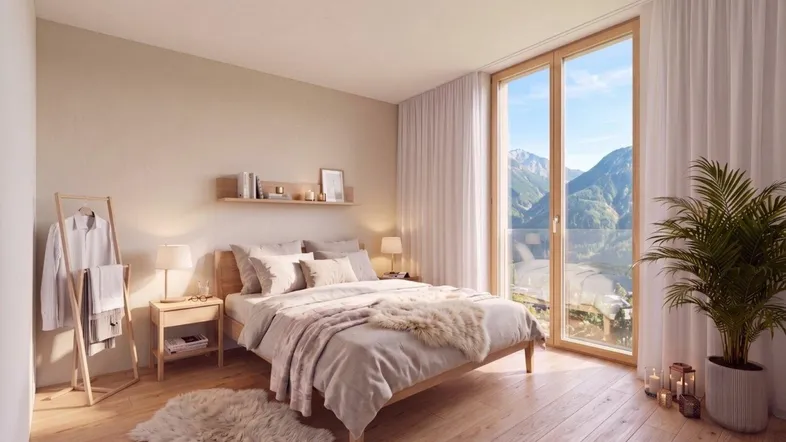 Helles Schlafzimmer mit Holzboden, großen Fenstern und beeindruckendem Bergblick.