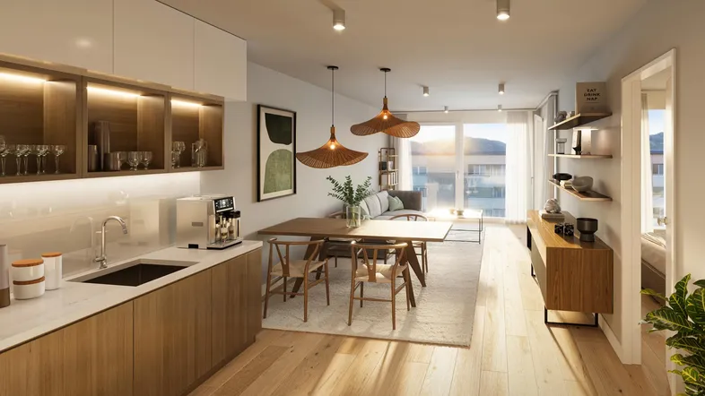 Heller, offener Wohn- und Essbereich mit moderner Küche, Holzboden und Zugang zum Balkon.