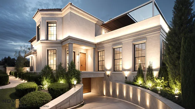 Elegante Villa bei Dämmerung mit beleuchteter Fassade und geschwungener Auffahrt.