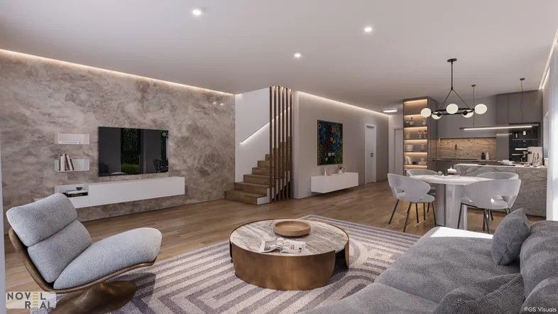 Offener Wohn- und Essbereich mit moderner Einrichtung, Holzboden und integrierter Küche, ideal für geselliges Beisammensein.