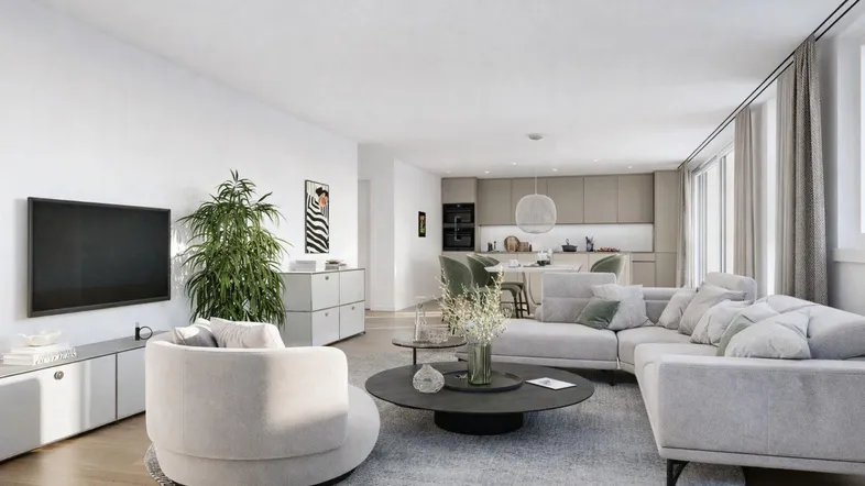 Helles, modernes Wohnzimmer mit offener Küche und bequemen Sitzgelegenheiten in neutralen Farbtönen.