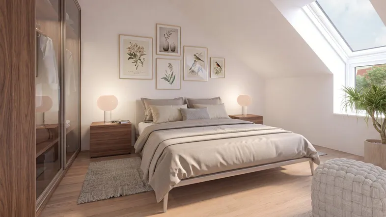 Helles Schlafzimmer im Dachgeschoss mit modernem Design, Dachfenster und integriertem Kleiderschrank.