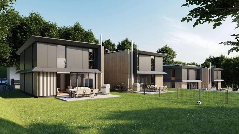 Moderne Reihenhäuser mit Flachdach, großen Terrassen und weitläufigem Gartenbereich.