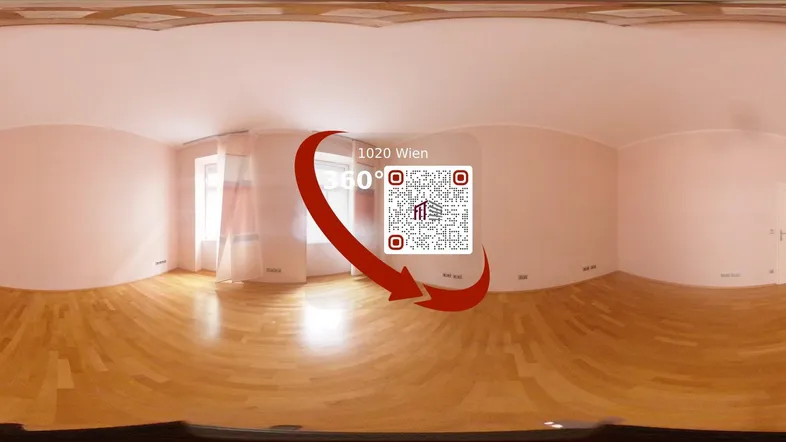 Heller, leerer Raum mit Parkettboden und hellrosa Wänden, bereit zur individuellen Gestaltung.