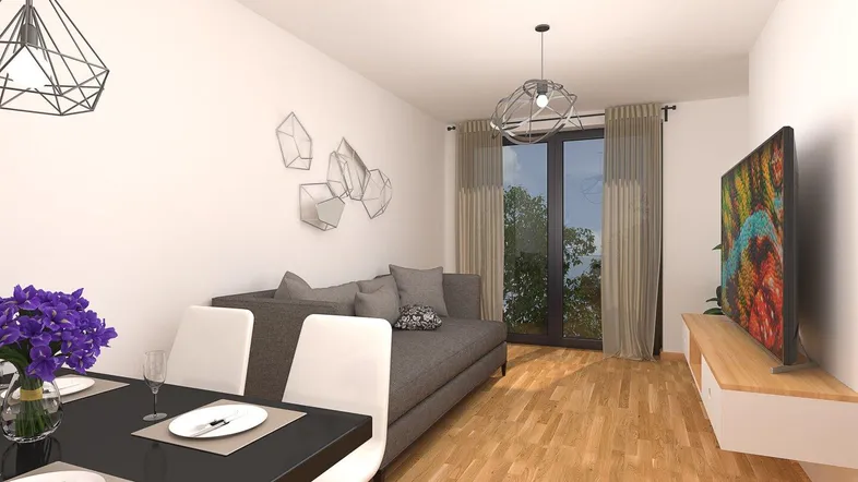 Moderner Wohn-Essbereich mit Holzboden, bequemer Couch und Esstisch für gesellige Abende.