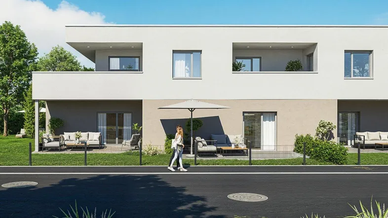 Moderne Wohnanlage mit klaren Linien, großzügigen Terrassen und Balkonen sowie grünen Außenbereichen.