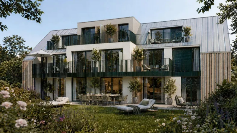Moderne Wohnanlage mit großzügigen Terrassen, Balkonen und einem gepflegten Gartenbereich im Vordergrund.