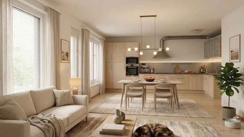 Modernes, offenes Wohn-Esszimmer mit integrierter Küche, hellen Holzmöbeln und gemütlichem Teppichboden.