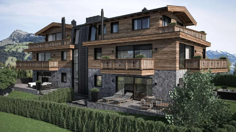 Moderne alpine Wohnanlage mit Holzfassade, Steinverkleidung und Balkonen in bergiger Landschaft.