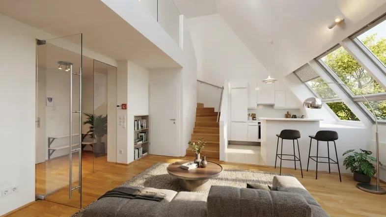 Helles, offenes Wohnzimmer mit integrierter Küche, Dachschrägen und großen Dachfenstern.