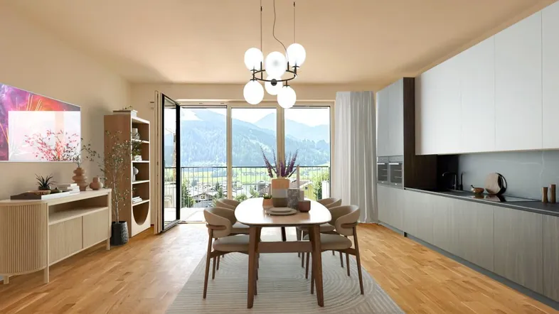 Helles, offenes Wohn-Esszimmer mit integrierter Küche, Holzboden und Bergblick.