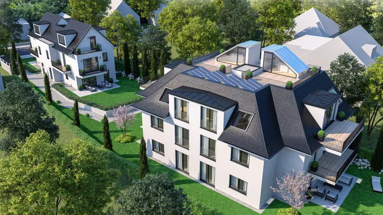 Moderne Wohngebäude mit ansprechender Architektur, grüner Umgebung und Dachterrassen.