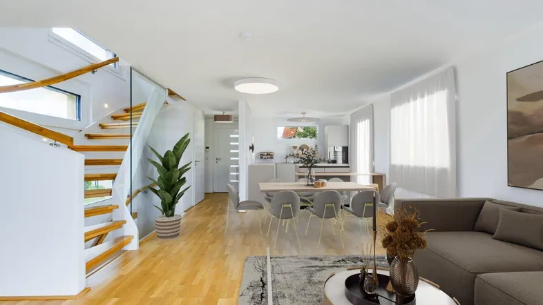 Heller, offener Wohn- und Essbereich mit moderner Küche, Holzfußboden und eleganter Treppe.