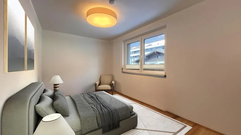 Helles Schlafzimmer mit Holzboden, großem Bett und Blick auf die Umgebung.