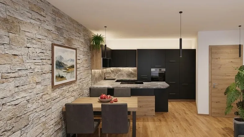 Moderne offene Küche mit dunklen Schränken, Steinwand und angrenzendem Essbereich.