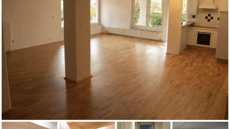 Heller, offener Wohn- und Essbereich mit Parkettboden, großen Fenstern und angrenzender Küche, inklusive separatem WC.