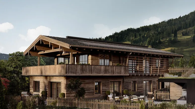 Moderne Holzchalet-Architektur mit großzügiger Terrasse und Bergblick in sonniger Umgebung.
