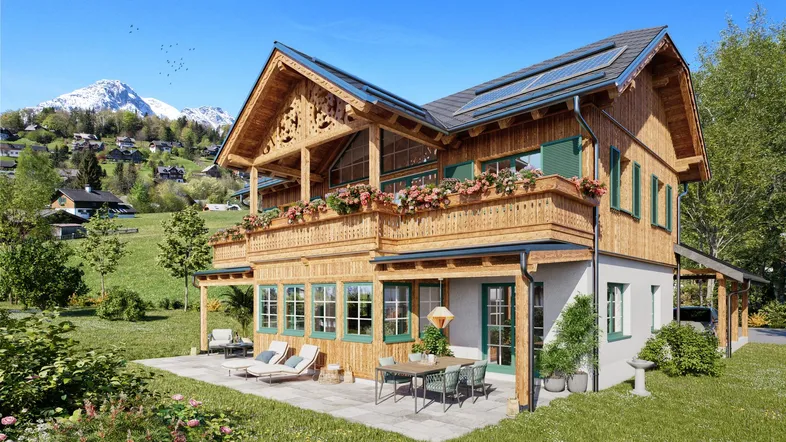 Modernes Chalet mit Holzfassade, großem Balkon, Terrasse und Bergblick in grüner Umgebung.