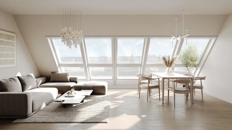 Helles Wohn- und Esszimmer im Dachgeschoss mit großen Fenstern und modernem Design.