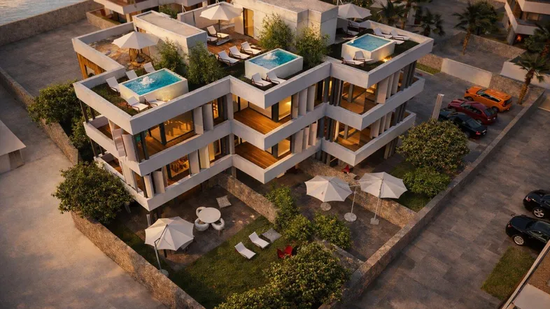 Moderne Wohnanlage mit mehreren Ebenen, Balkonen, Dachterrassen mit Pools und einem Gartenbereich.