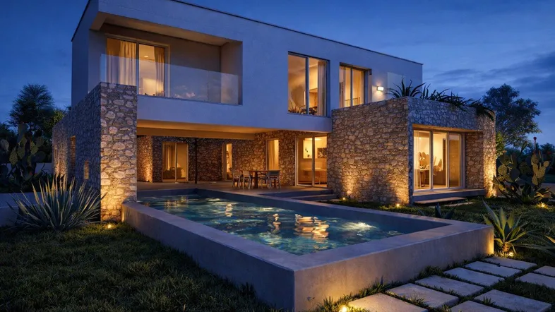 Moderne Villa bei Nacht mit beleuchtetem Pool, Steinfassade und gemütlichem Außenbereich.