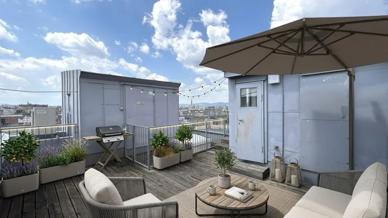 Möblierte Dachterrasse mit Grillbereich, Sonnenschirm und weitem Blick über die Stadt.