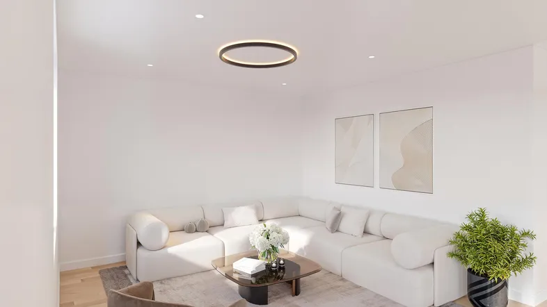 Helles Wohnzimmer mit modernem Ecksofa, Couchtisch und Holzboden, ideal für entspannte Stunden.