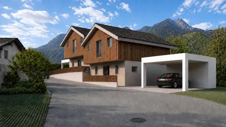 Neubau-Doppelhaushälfte mit Holzverkleidung und Carport in ländlicher Umgebung mit Bergblick.