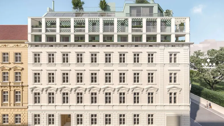 Vorderansicht eines modernisierten Altbaus mit neuen Dachgeschosswohnungen und begrünten Terrassen.