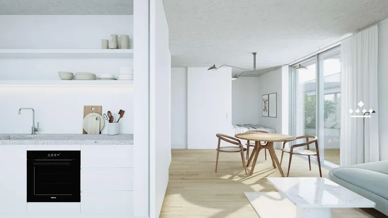 Helle, offene Wohnküche mit integriertem Essbereich und modernem Design, ideal für geselliges Beisammensein.