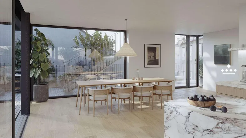 Heller Essbereich in einem offenen Wohnraum mit großen Fenstern und Zugang zur Terrasse.