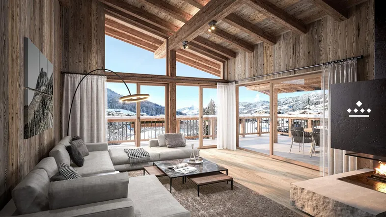 Geräumiges Wohnzimmer mit hohen Holzdecken, Kamin und Panoramablick auf die verschneite Berglandschaft.