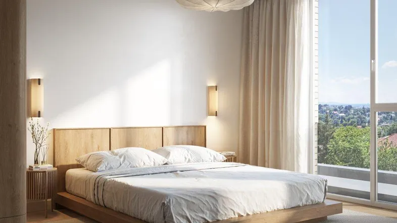Modernes Schlafzimmer mit Holzboden, großen Fenstern und weitem Ausblick in die Natur.