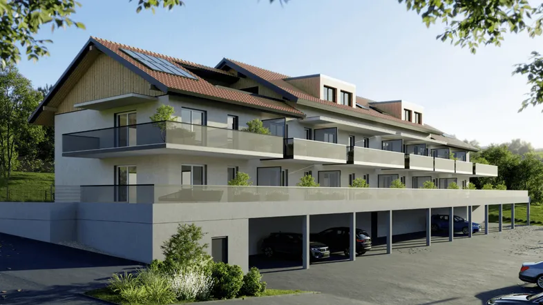 Moderne Wohnanlage mit Balkonen, Carport und Photovoltaikanlage in grüner Umgebung.