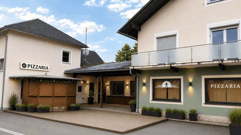 Außenansicht eines Gebäudes mit Pizzeria-Beschilderung und einer Holzterrasse für Gäste.