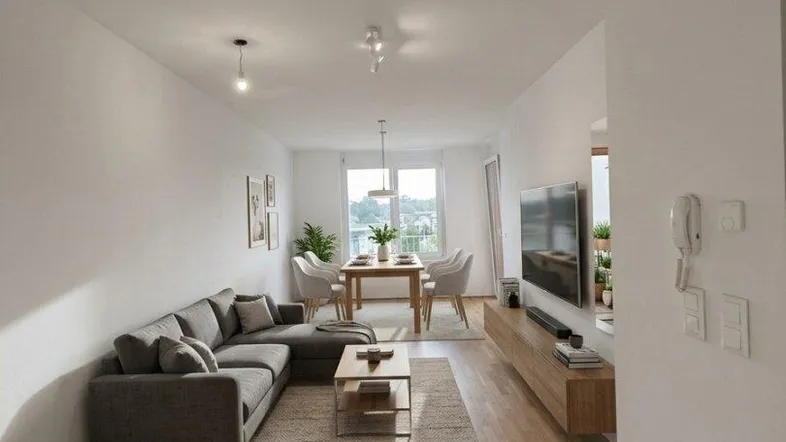 Helles Wohn-Esszimmer mit modernem Sofa, Holzboden und Essbereich am Fenster.