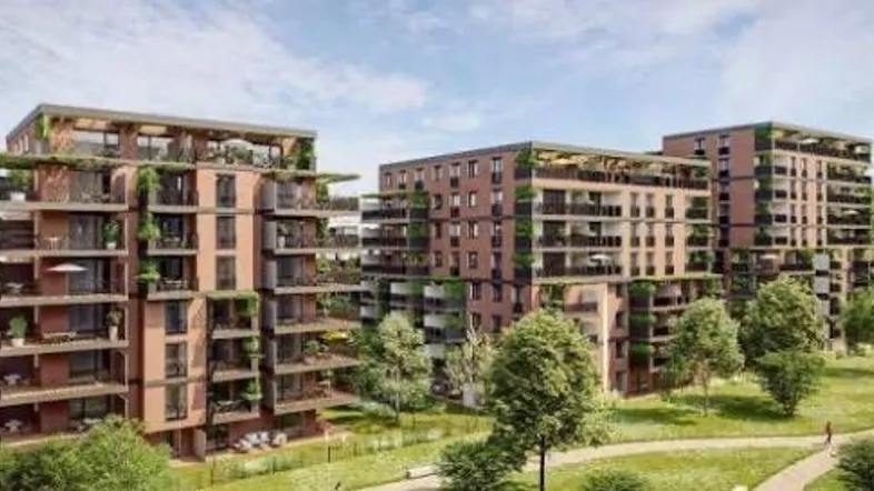 Moderne Wohngebäude mit begrünten Balkonen und umliegender Parklandschaft.
