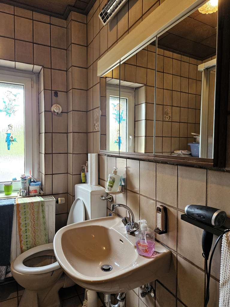 Immobilie in Geseke - Geseke: Mehrfamilienhaus mit modernisierten Wohnungen & Potenzial - Bild 4