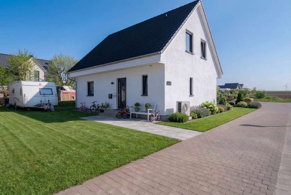 Immobilie in Uelversheim - Neubau ohne Bauphase – stilvolles Einfamilienhaus (KfW 40 QNG) auf großzügigem Eckgrundstück - Bild 1