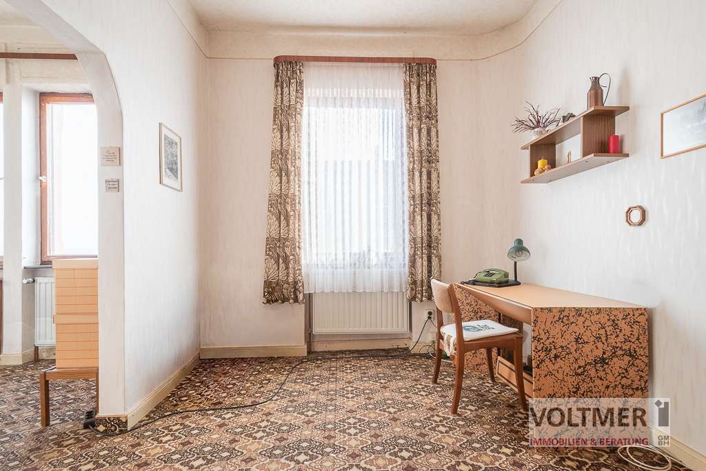 Immobilie in Spiesen-Elversberg - GESTALTUNGSFREIHEIT - sanierungsbedürftiges Einfamilienhaus mit Garage und Garten in Elversberg! - Bild 1