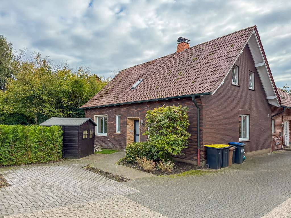 Immobilie in Raesfeld - Zwei Einfamilienhäuser mit zusätzlichem Baupotenzial in Raesfeld - Bild 1