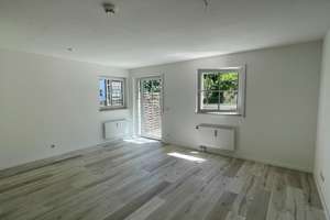 Charmante 2-Zimmer-Wohnung mit Terrasse und Gartenanteil