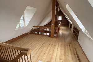 Wohnen mit Geschichte – außergewöhnliche Maisonettewohnung im historischen Frohnhof Worringen