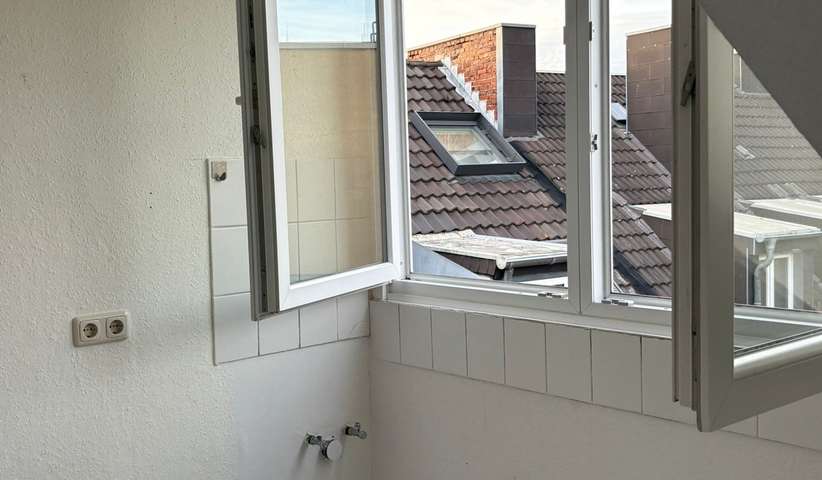 21 m² Dachgeschosswohnung mitten in der City - Foto 1