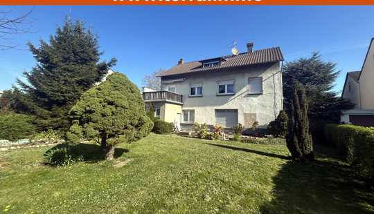 Bild von Mehrfamilienhaus mit Nebengebäude und großem Garten!