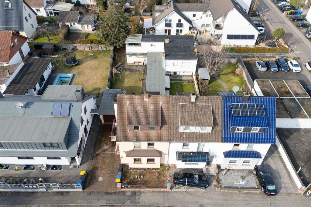 Immobilie in Nauheim - Familienfreundliches Reiheneckhaus mit großem Sonnengarten und Nebengebäude - Bild 4