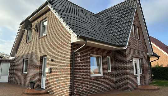 Bild von Stilvolles Traumhaus mit besonderem Holzfachwerkgiebel und hochwertiger Ausstattung