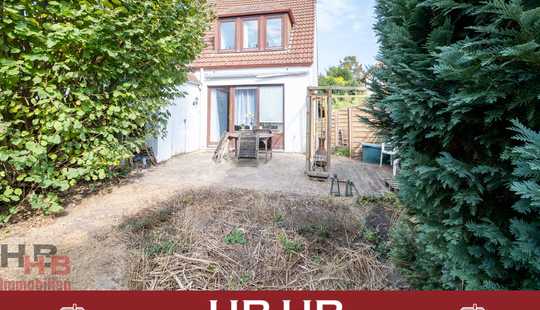 Bild von Reihenendhaus mit Sonnenterrasse, uneinsehbarem Garten und Garage