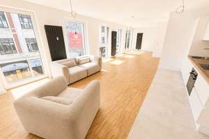 Erstbezug auf ca. 65 m²: Lichtdurchflutetes Appartment mit EBK, Schrank, Bett & Sofa